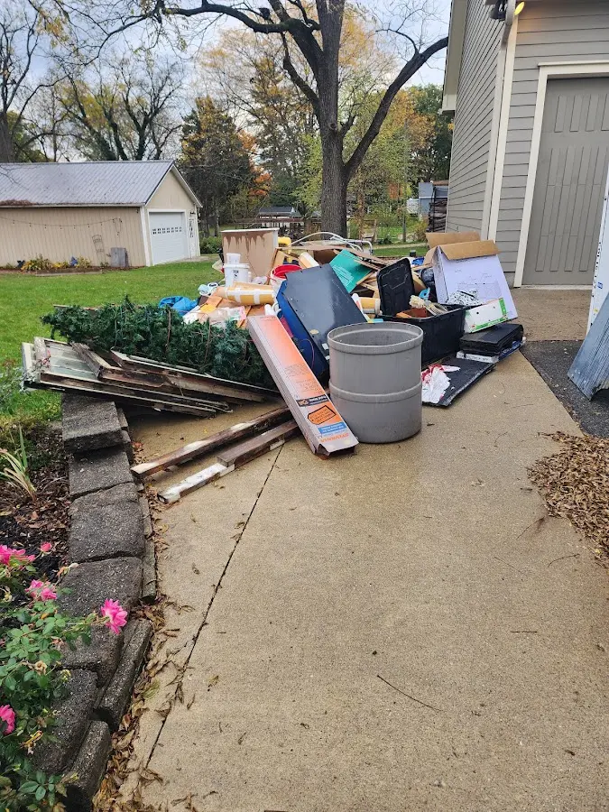 Dumpster being loaded with debris for Commercial Dumpster Rental in Fairhope